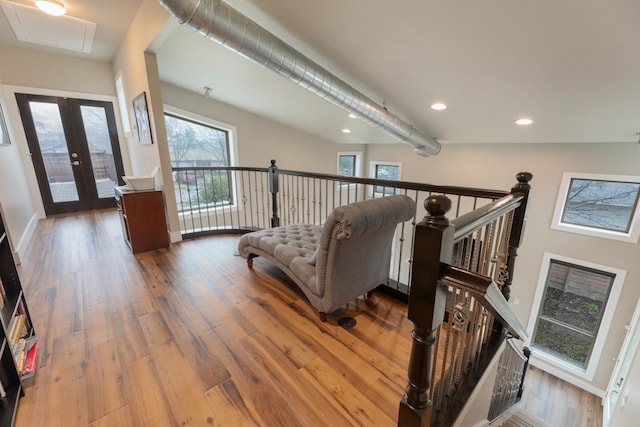 3301 Rockhurst Ln, Austin, TX 78723 - living area featuring attic access, an upstairs landing, wood finished floors, and recessed lighting