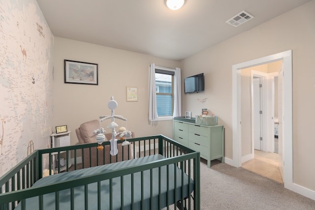 3301 Rockhurst Ln, Austin, TX 78723 - bedroom with light colored carpet and a nursery area