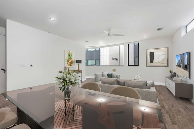 dining room featuring ceiling fan and wood-type flooring