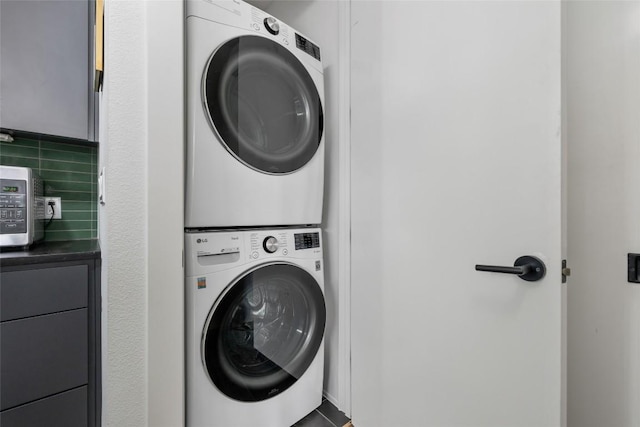 laundry room featuring stacked washing maching and dryer