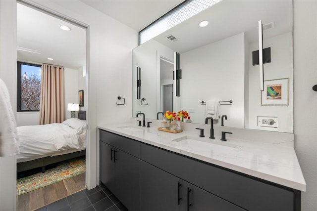 bathroom featuring tile patterned flooring and vanity