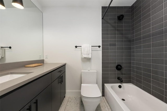 full bathroom featuring vanity, toilet, and tiled shower / bath combo