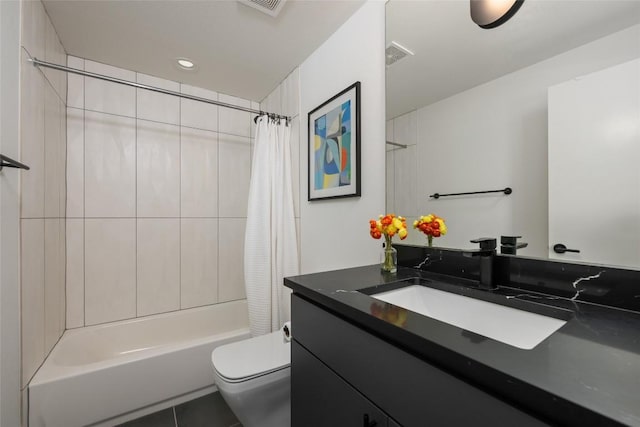 full bathroom featuring vanity, shower / bath combo with shower curtain, and toilet