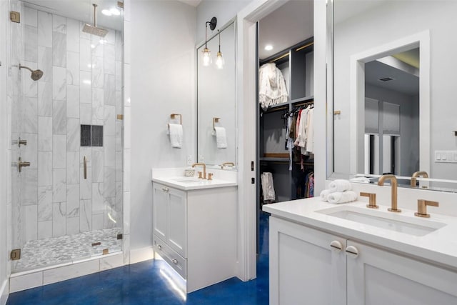 bathroom with vanity and a shower with door