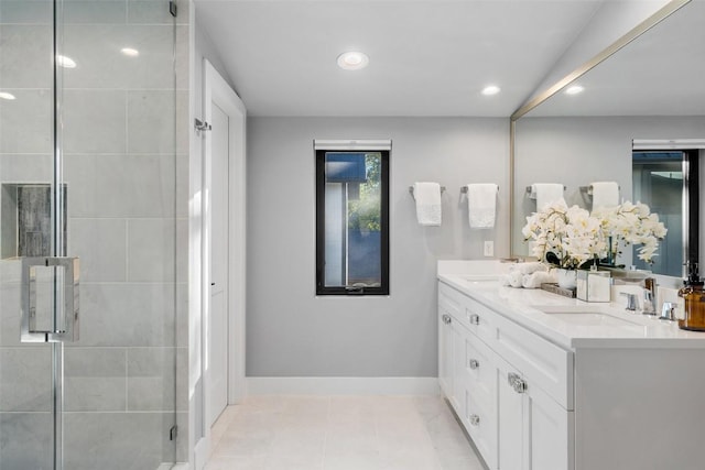 bathroom featuring walk in shower, tile patterned floors, and vanity