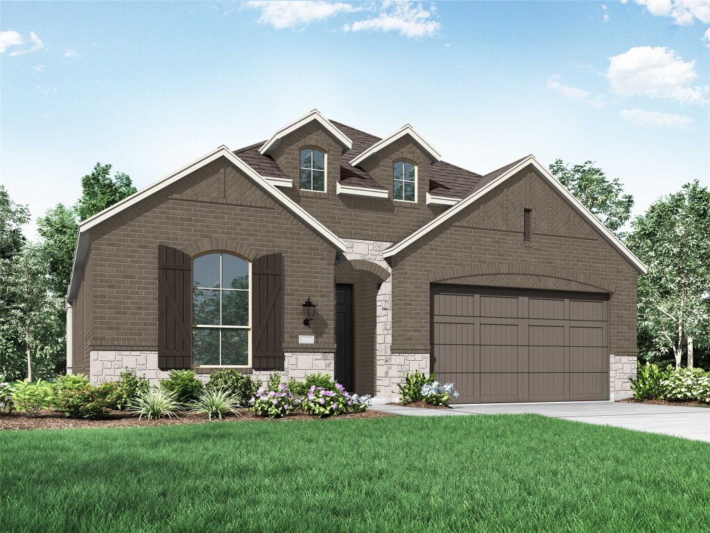 586 Biscayne Bay Bnd, Kyle, TX 78640 - view of front facade featuring stone siding, brick siding, a front lawn, and a garage