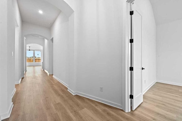 586 Biscayne Bay Bnd, Kyle, TX 78640 - hall featuring arched walkways and wood finished floors
