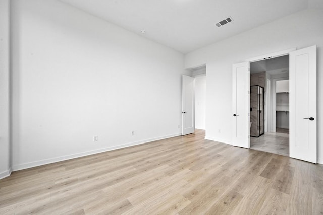 586 Biscayne Bay Bnd, Kyle, TX 78640 - unfurnished bedroom with light wood-style flooring and baseboards