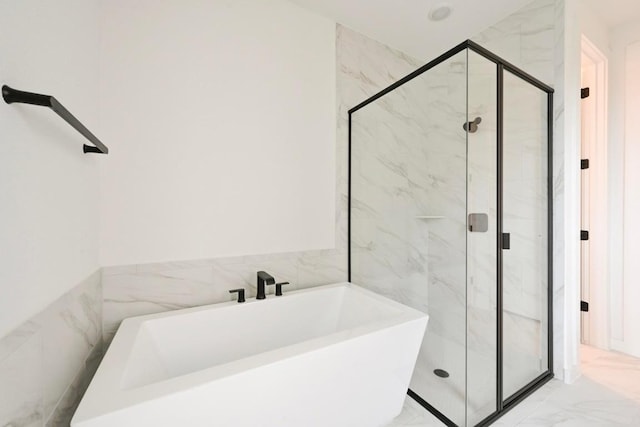 586 Biscayne Bay Bnd, Kyle, TX 78640 - full bathroom featuring marble finish floors, a freestanding tub, and a marble finish shower