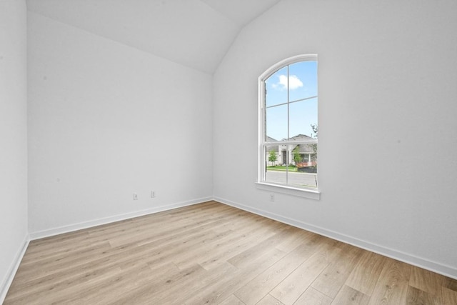 586 Biscayne Bay Bnd, Kyle, TX 78640 - spare room with light wood-style flooring and lofted ceiling
