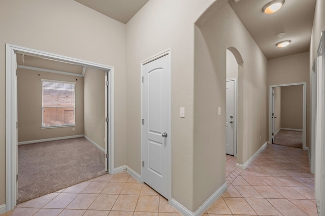 hallway featuring light tile patterned floors