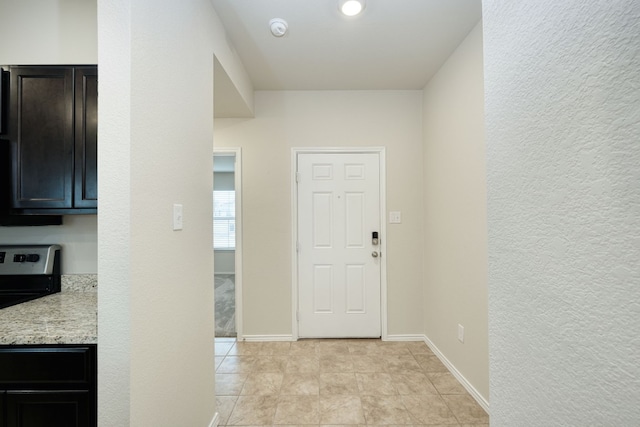 foyer with light tile patterned floors