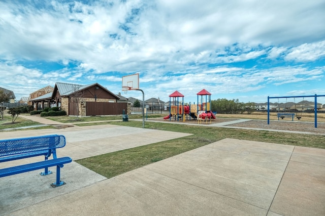 view of sport court with a playground