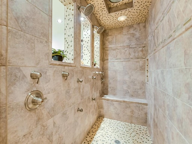 bathroom with a tile shower