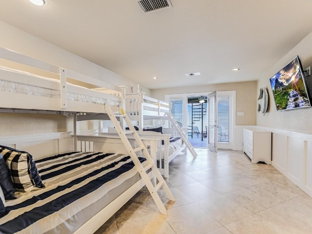 tiled bedroom featuring access to outside