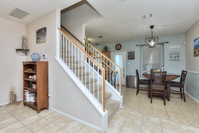 staircase with tile patterned flooring