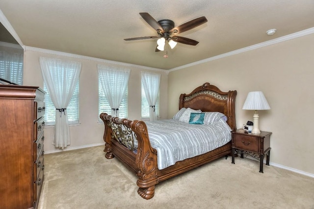 carpeted bedroom featuring ceiling fan and ornamental molding