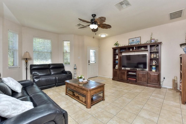 living room with light tile patterned floors and ceiling fan