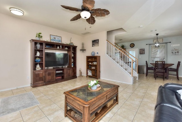 tiled living room with ceiling fan