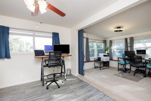 office featuring lofted ceiling, ceiling fan, plenty of natural light, and wood-type flooring