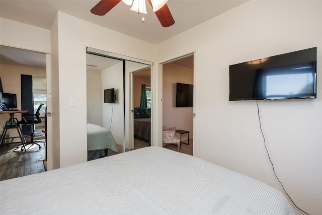 bedroom featuring dark hardwood / wood-style flooring, a closet, and ceiling fan