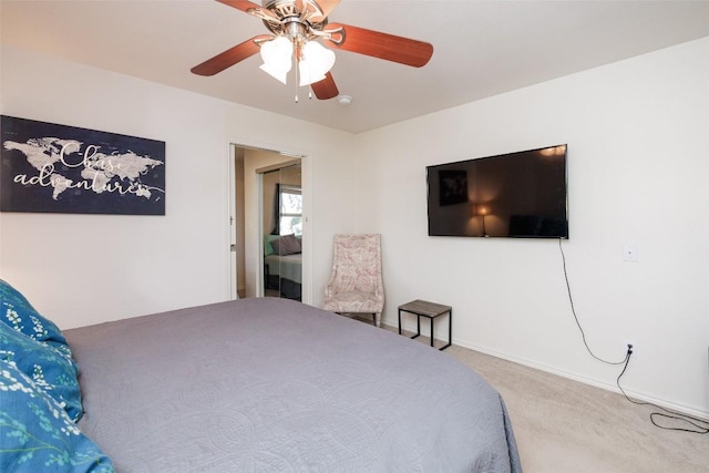 bedroom with ceiling fan and carpet flooring