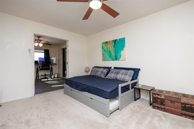 bedroom with ceiling fan and carpet