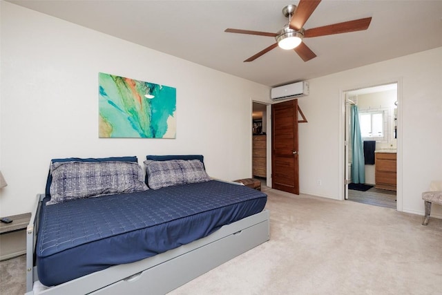 bedroom featuring ceiling fan, ensuite bath, carpet, and an AC wall unit