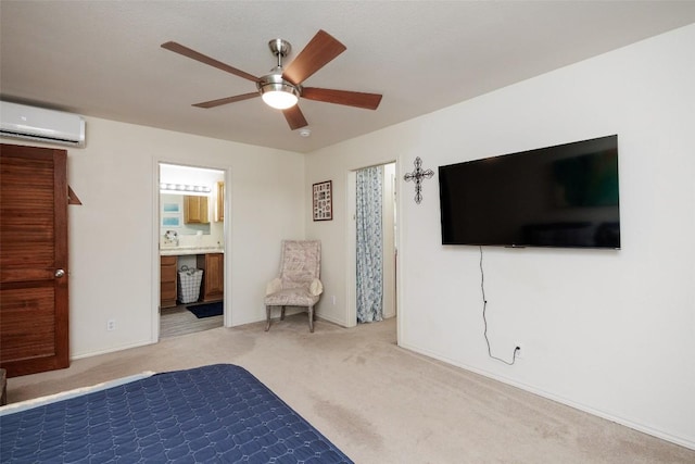 unfurnished bedroom featuring ceiling fan, light colored carpet, ensuite bathroom, and a wall unit AC