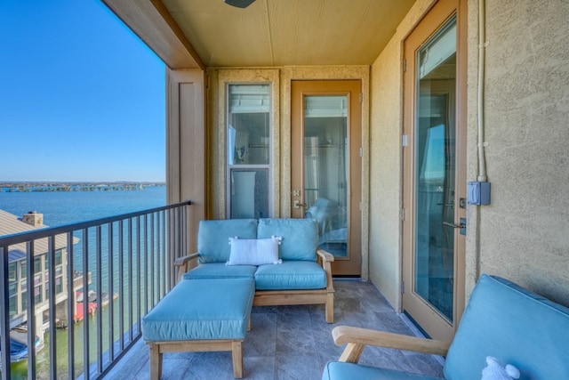 balcony featuring a water view