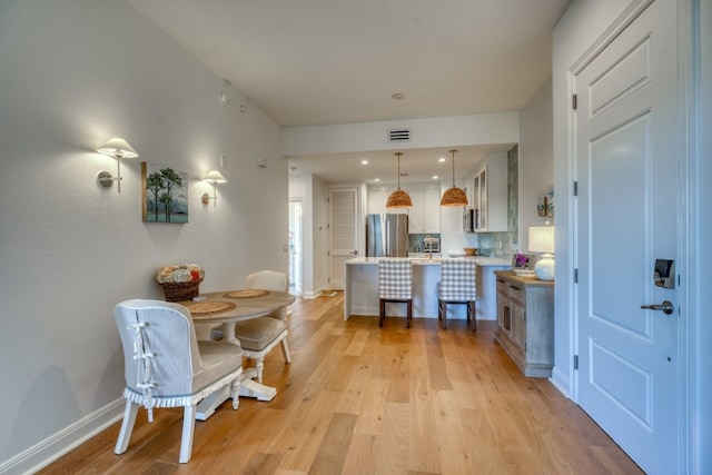 dining room featuring light wood-type flooring