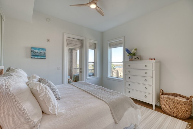 bedroom with ceiling fan, hardwood / wood-style floors, and access to outside