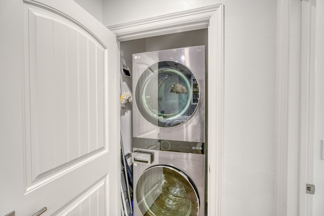 laundry room featuring stacked washer / dryer