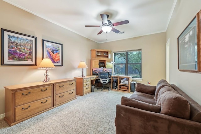 office with light colored carpet, a ceiling fan, and crown molding