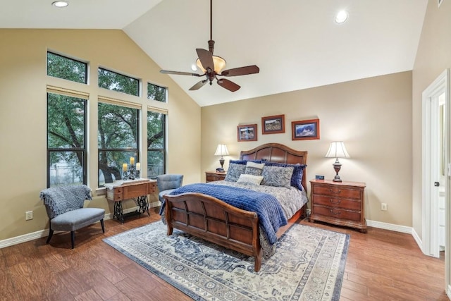 bedroom with high vaulted ceiling, wood finished floors, baseboards, recessed lighting, and a ceiling fan