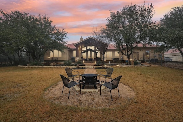 view of yard at dusk