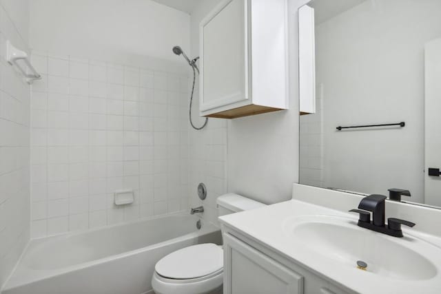 full bathroom with vanity, toilet, and tiled shower / bath combo