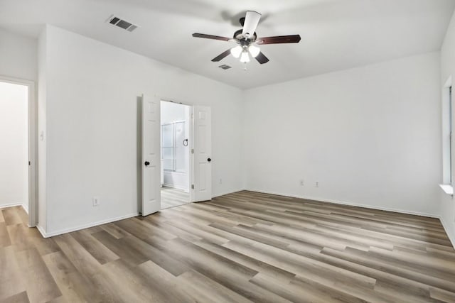 unfurnished room featuring ceiling fan and light hardwood / wood-style floors