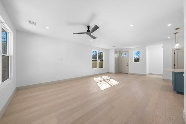 512 W Saint Johns Ave Unit A, Austin, TX 78752 - unfurnished living room with light wood-style flooring, recessed lighting, baseboards, and a ceiling fan