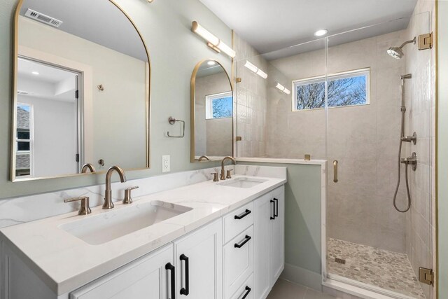 512 W Saint Johns Ave Unit A, Austin, TX 78752 - full bathroom with a stall shower, double vanity, and recessed lighting