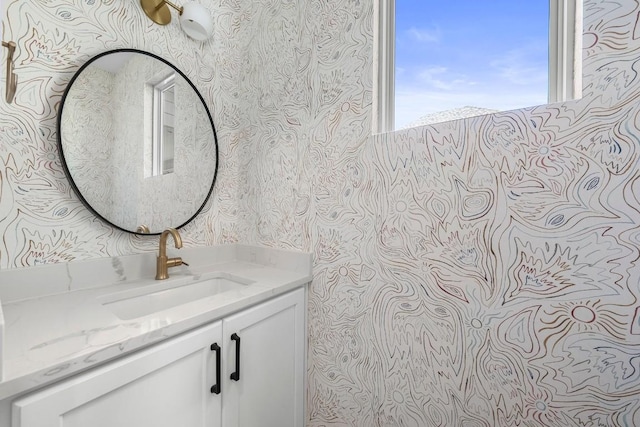 512 W Saint Johns Ave Unit A, Austin, TX 78752 - bathroom with wallpapered walls and vanity