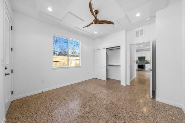 unfurnished bedroom with visible vents, recessed lighting, speckled floor, and baseboards