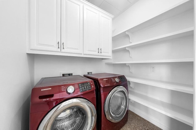 washroom with cabinet space and washing machine and dryer