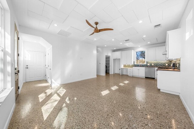 unfurnished living room with visible vents, recessed lighting, baseboards, and ceiling fan