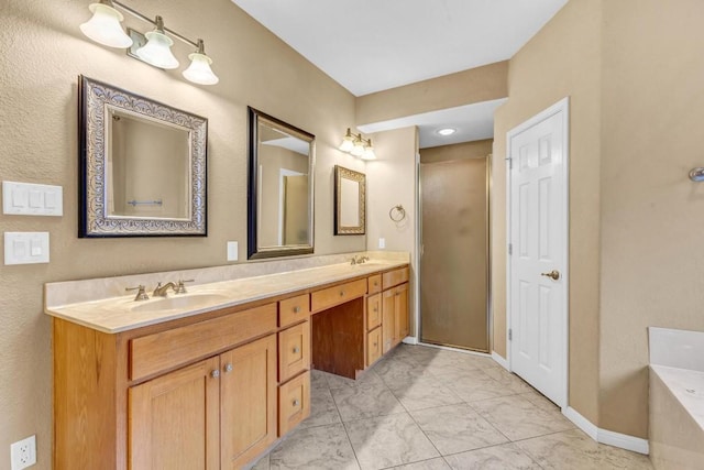 205 Errol Dr, Spicewood, TX 78669 - full bathroom featuring double vanity, a tub to relax in, marble look tiles, a shower with shower door, and baseboards