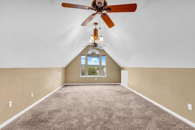 additional living space with vaulted ceiling and carpet