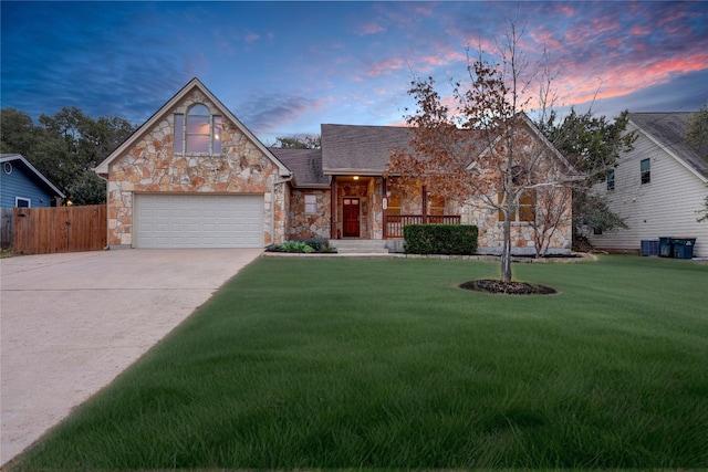 205 Errol Dr, Spicewood, TX 78669 - view of front of house featuring stone siding, concrete driveway, an attached garage, and a porch