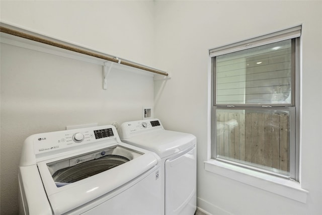 washroom with independent washer and dryer