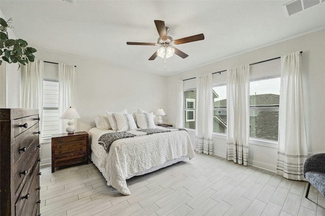 bedroom featuring ceiling fan and light hardwood / wood-style floors