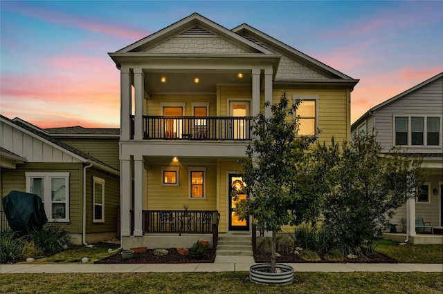 view of front facade featuring a porch and a balcony